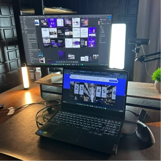 Dual-monitor setup with design work in progress